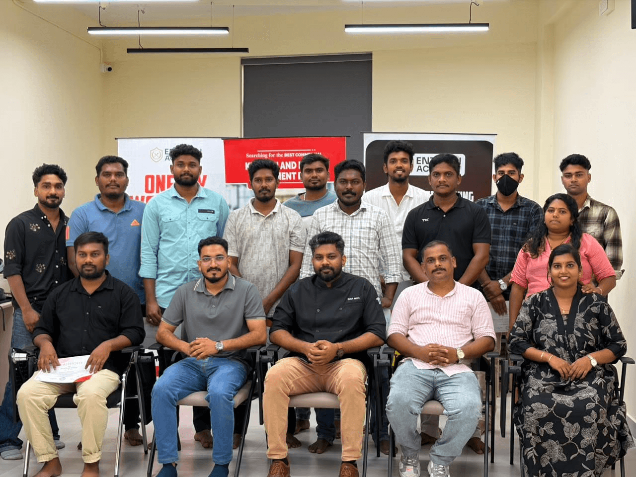 Workshop participants celebrating their culinary training at Entrain Academy